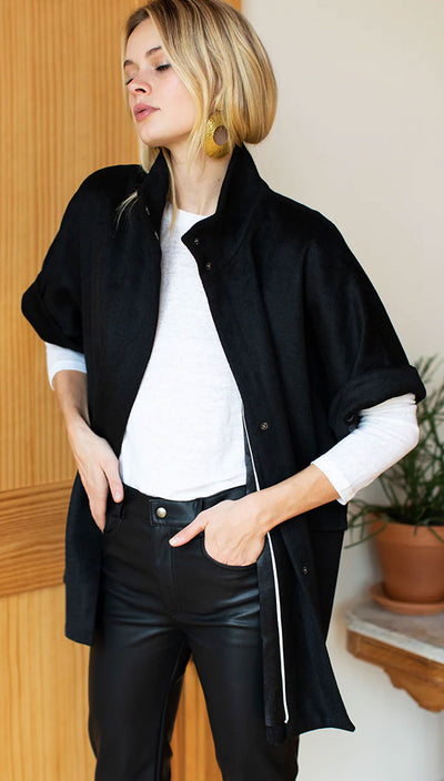 Minimalist black fall jacket styled with cozy layers