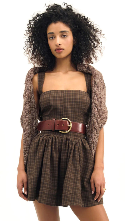 pretty Woman wearing a plaid dress with a brown belt and a brown cardigan on a white background Ginny Mini Dress | For Love and Lemons